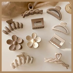 Elegant beige and brown matte large hair claw clips set in various geometric shapes