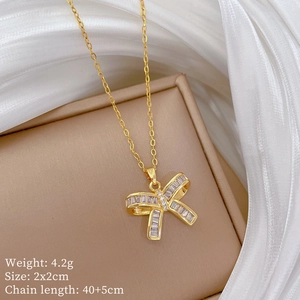 Detailed view of a gold butterfly zircon necklace with dimensions 2x2cm and 4.2g weight
