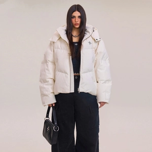 Oversized white hooded down jacket with quilted texture and cross logo for winter warmth