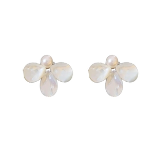 Elegant shell petal earrings with central pearl on minimalist white background