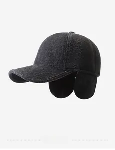 Detail view of winter woolen baseball cap with ear protection and silver metal F logo