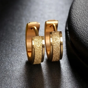 Detail view of gold stainless steel hoop earrings with polished and frosted dual-texture finish