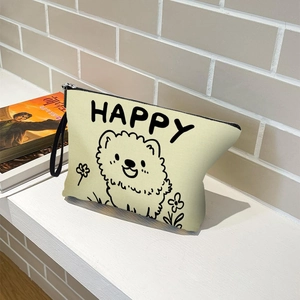 Portable beige canvas makeup bag with cartoon dog print and black handle for travel