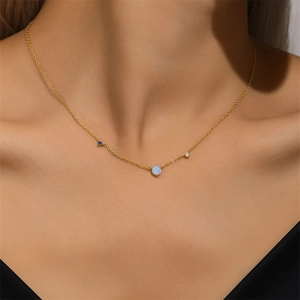 Detailed close-up of S925 silver gold necklace featuring opal and zircon stones on model