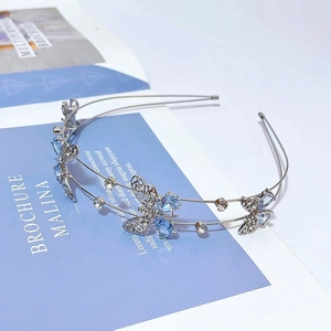 Serre-tête double en métal argenté avec papillon en cristal bleu et pierres zircon