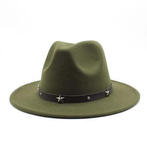 Detail showing olive green fedora hat with star-studded leather band and metal rivets