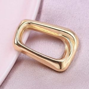 Detailed macro view of a golden rectangular 304 stainless steel jewelry pendant piece