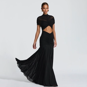 Detail view of black mesh evening gown featuring cut-out waist and pleated mermaid skirt