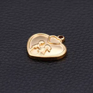 Golden heart pendant featuring a couple silhouette engraving on black leather surface