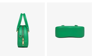 Detail view of green PVC jelly bag featuring a curved base and gold metal zipper hardware