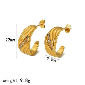 Gold C-shaped stainless steel earrings with sparkling zircon inlay and textured finish