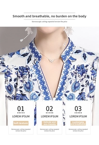 Detail of V-neck printed dress showing vintage blue floral pattern on white chiffon fabric