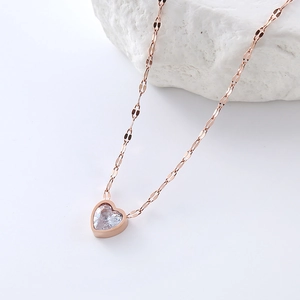 Rose gold heart pendant necklace with a sparkling zircon inlay on a textured lip chain