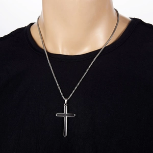 Men's minimalist stainless steel cross necklace with black epoxy pendant on male model