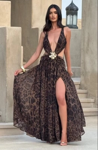 Detail of leopard print dress with gold flower buckle, deep V-neck and high leg slit