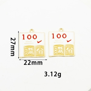 Detail view of alloy exam charm showing 27mm height, 22mm width and 100 points marking