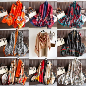 Detailed grid view of assorted silk scarves with ginkgo leaf and luxury fashion patterns