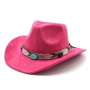 Detail of fuchsia suede cowboy hat with ethnic braided band and turquoise stone
