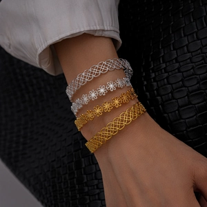 Hollow flower and geometric metallic bangles in gold and silver finish set