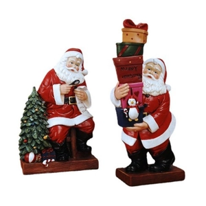 Santa Claus resin figurines with mini Christmas tree and gift boxes set on white background