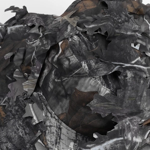Detailed macro view of 3D leaf camouflage fabric with laser-cut edges for concealment
