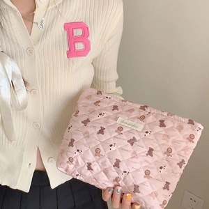 Pink quilted makeup bag with cute bear pattern and large capacity for travel storage
