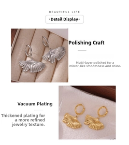 Detailed view of polished ginkgo leaf earrings with vacuum plating finish