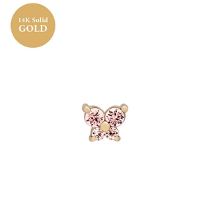 Detailed macro of 14K solid gold butterfly stud earring with sparkling pink gemstones
