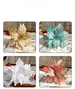 Detail view of glitter artificial Poinsettia flowers in four elegant festive colors