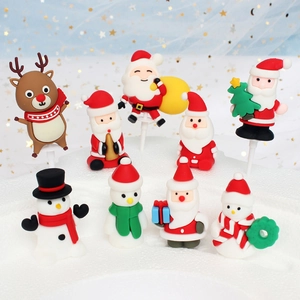 9-piece set of polymer clay Christmas cake toppers with Santa, snowman and reindeer designs