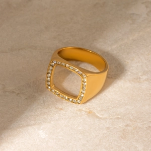 Detail shot of a square hollow 18k gold plated ring with micro-pave crystals on stone
