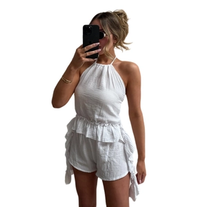 White halter top and ruffled shorts two-piece muslin set for women on white background