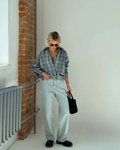 Classic blue plaid cotton shirt styled with light blue straight-leg denim jeans