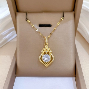 Macro detail of royal teardrop crystal pendant in gold vintage filigree design