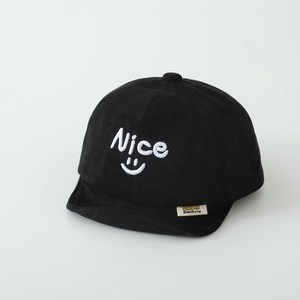 Close-up of black baby suede cap with Nice embroidery and soft brim detail