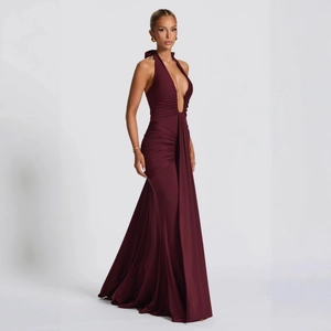 Detail of elegant backless halter neck maxi dress with ruched waist in burgundy wine