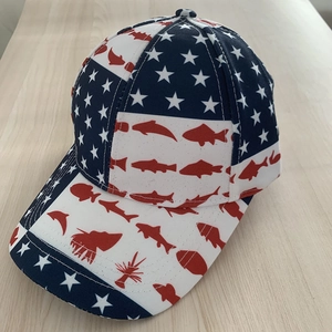 Unisex US flag baseball cap with stars and red fish print on wood surface
