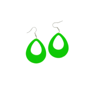Macro shot of fluorescent green teardrop acrylic earrings with openwork design