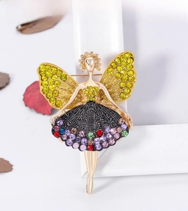 Close-up of ballet girl brooch featuring golden butterfly wings and colorful rhinestones
