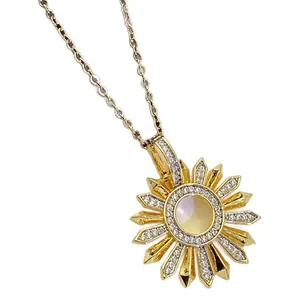 Golden sunburst pendant necklace with sparkling zircon stones on a fine link chain