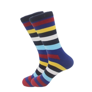 Detail of colorful striped athletic crew socks with elastic cuffs on a white background