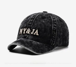 Detail view of washed cotton baseball cap with vintage NY&JA 3D embroidery and short brim