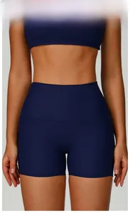 Close-up of high-waist navy blue ribbed yoga shorts with tummy control and seamless texture