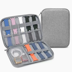 Gray fabric travel organizer pouch for Apple Watch bands and accessories showing interior