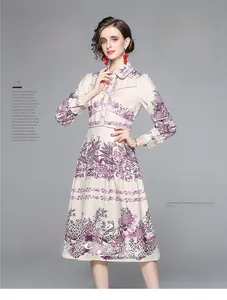 Detail of floral printed midi dress featuring elegant lapel collar and long sleeves