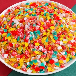 Christmas resin charms mix with Santa Claus, reindeer and trees in a white bowl