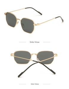 Detail view of gold metal sunglasses with dark lenses and durable side hinges