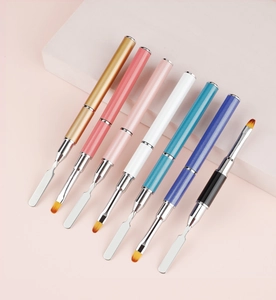 Set of 7 dual-ended nail art brushes with stainless steel spatulas on a pink display