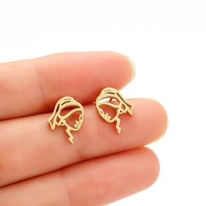 Gold abstract hollow Girl with a Pearl Earring silhouette stud earrings held by hand