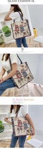 Detail of embroidered owl pattern on canvas tote bag with bohemian ethnic woven straps